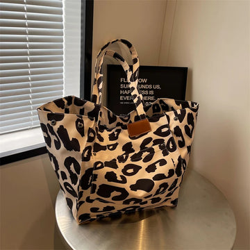 Evie - Bolso de mano de mujer con estampado de leopardo.