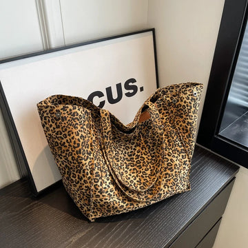 Evie - Bolso de mano de mujer con estampado de leopardo.