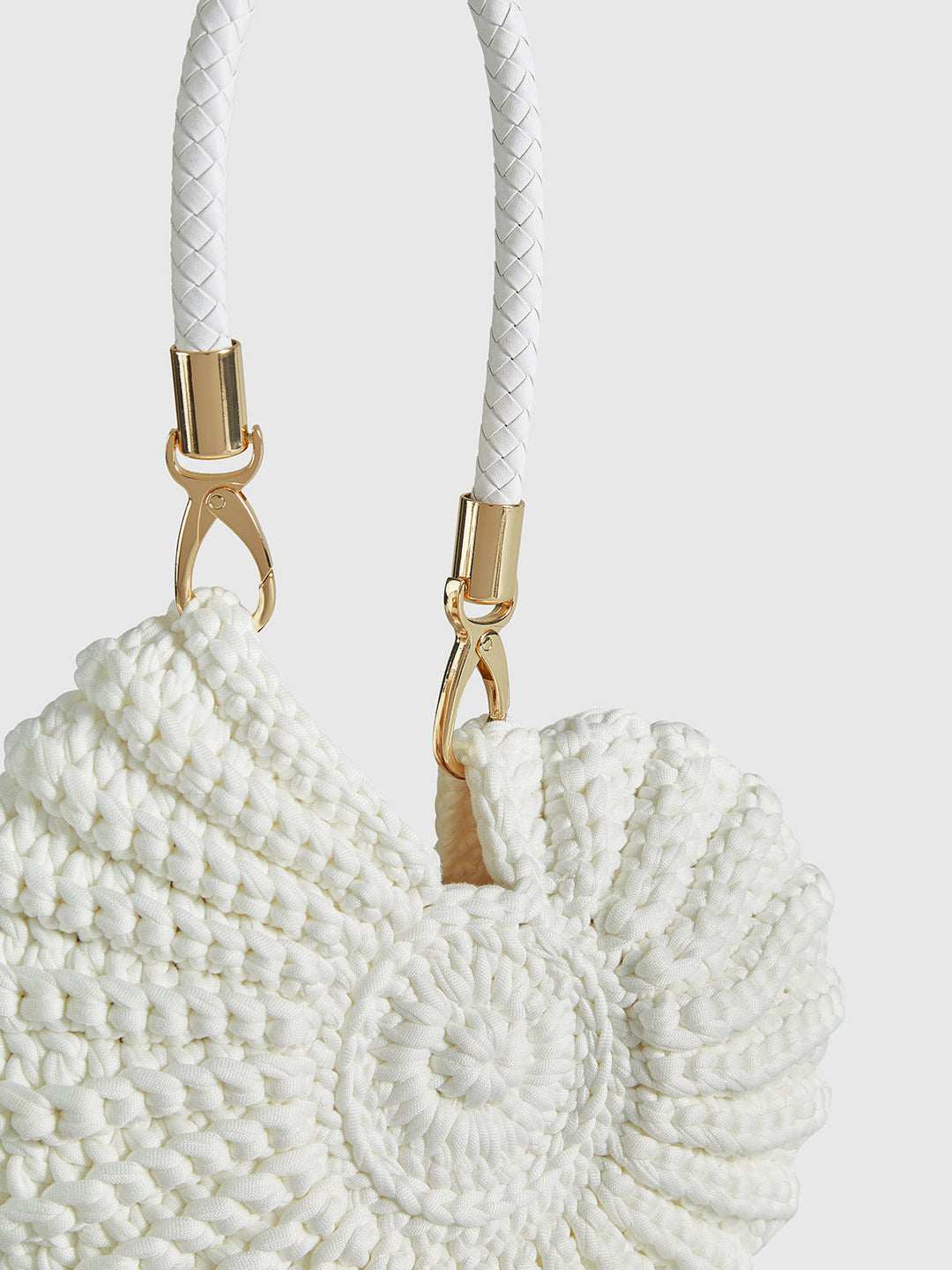 Davina | Bolso redondo trenzado con asa, elegante y moderno