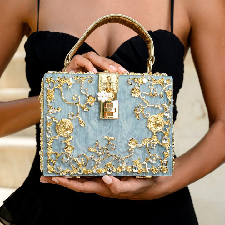 Cathy | Bolsa de caja exclusiva, diseño de lujo, detalles florales dorados, elegante cierre metálico